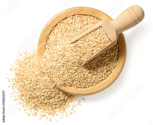 raw wheat germ in the wooden bowl, isolated on the white background, top view