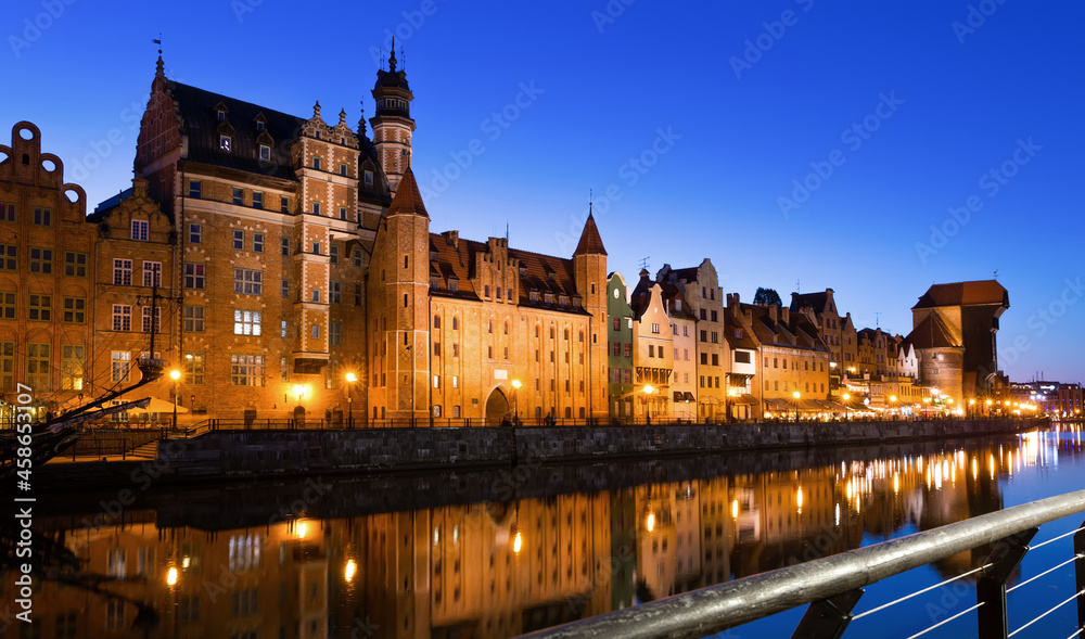 Picturesque Motlawa river embankment in old Polish town of Gdansk in twilight.