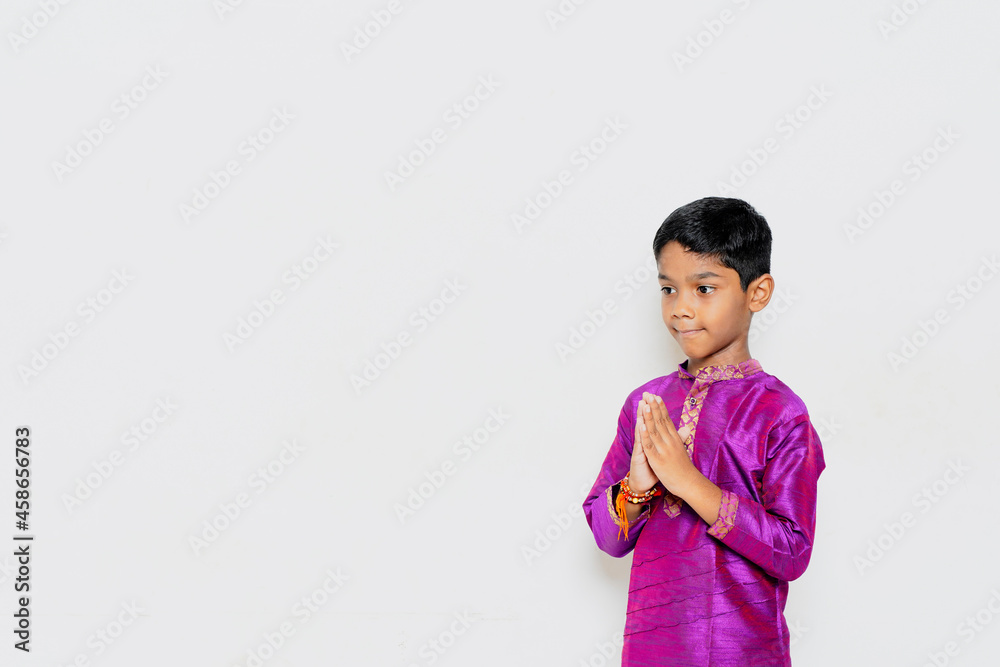 Indian Little Boy in traditional wear and praying Indian Little Boy in traditional wear and praying