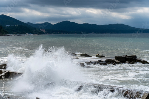 small storm on the sea, waves hitting the shore