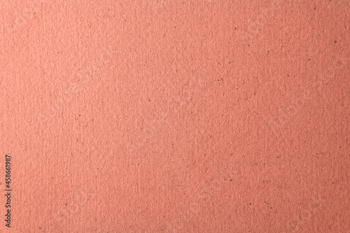 Blank coral color or soft pale red pink tone on rough cardboard box organic paper texture to be use for card website or banner decoration background