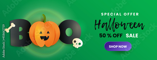Happy Halloween sale banner. Inscription boo, skull , bone and pumpkin in paper cut style. Funny paper pumpkin with black letters on green background. 
