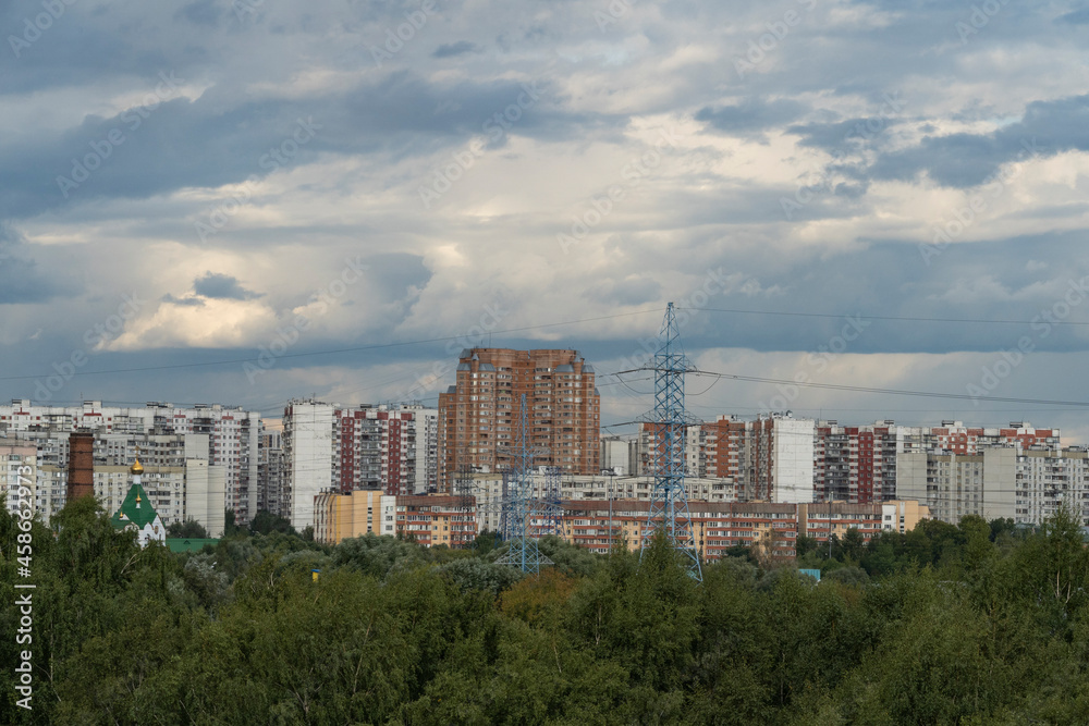 City landscape against the backdrop of a stormy sky.