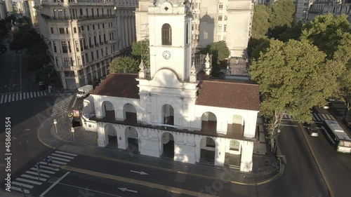 Aerial Drone flying around the Cabildo building of Buenos Aires, Argentina. May Square, Famous Revolution's landmark, morning sun. photo