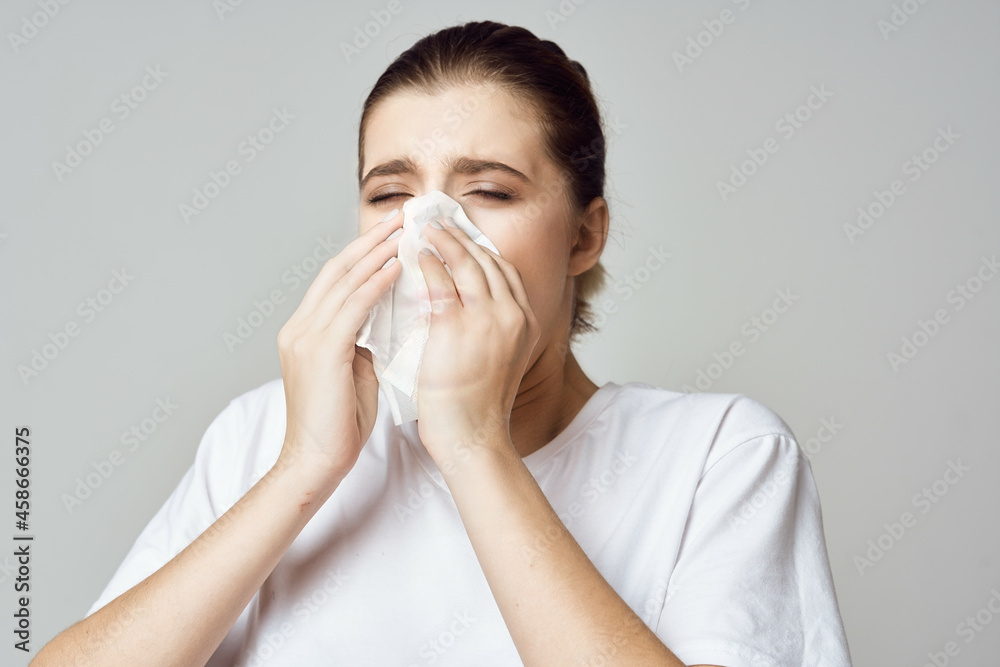 woman in white t-shirt handkerchief cold health problems woman in white t-shirt handkerchief cold health problems
