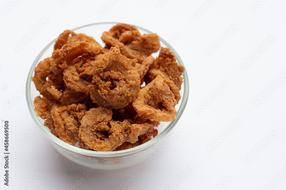 Fried crispy pork belly recipe in glass bowl on white background. Fried crispy pork belly recipe in glass bowl on white background.