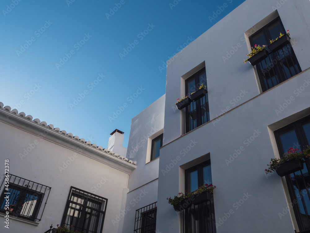 Modern white building with blue sky, horizontal photography