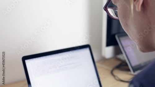 Business woman typing on computer keyboard at office workplace, video footage