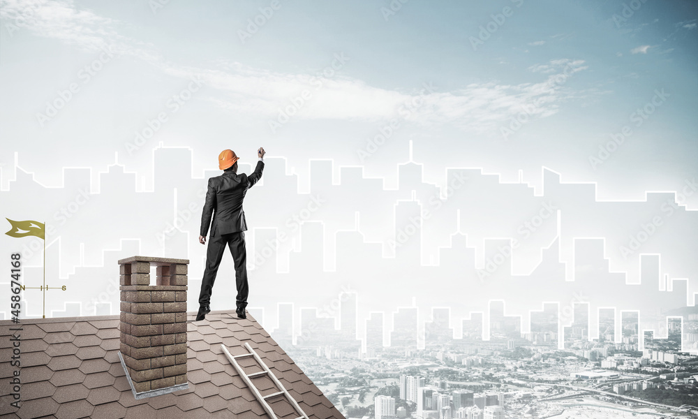 Man architect draw silhouette of modern city on blue sky. Mixed Man architect draw silhouette of modern city on blue sky. Mixed