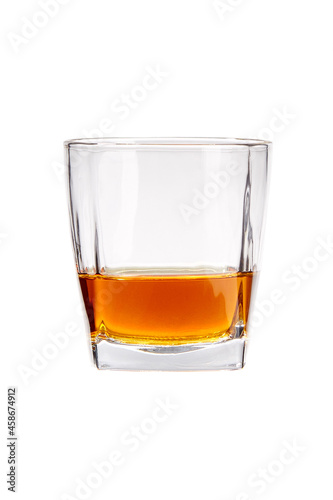 Shot of glass is half full of whiskey. Glasses are isolated on the white background.
