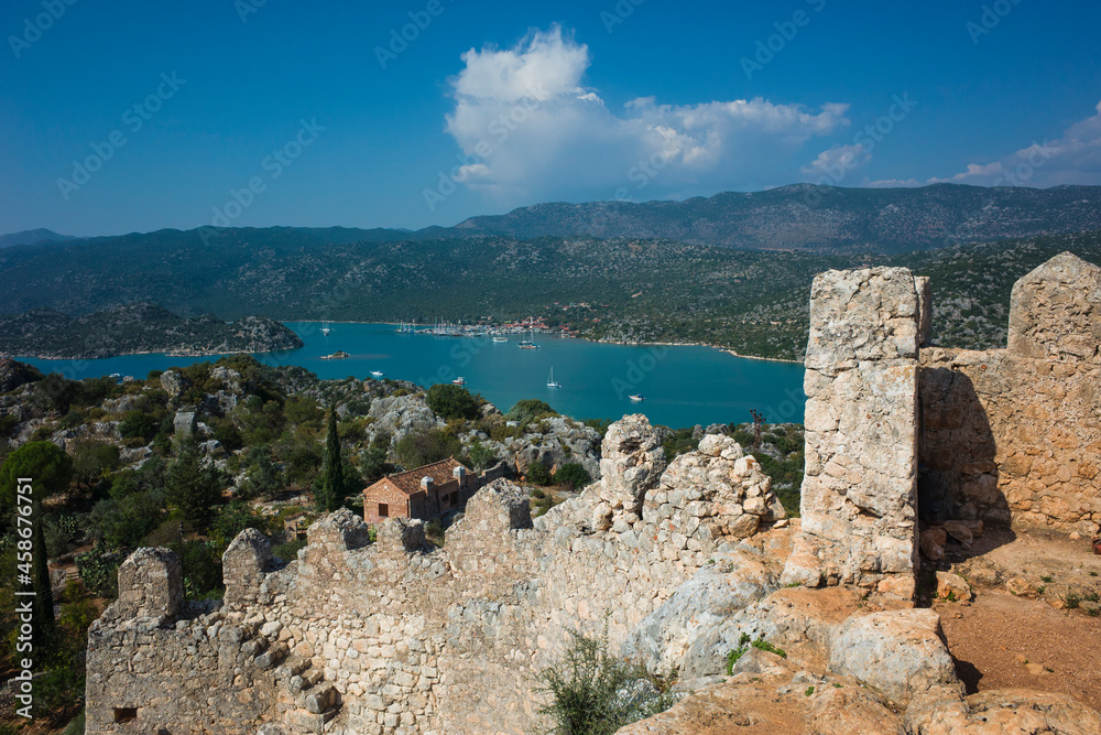 View from Simena castle wall on tranquil rural Mediterranean coast landscape in Simena (Kalekoy), Turkey. Old stone fortress with sea view