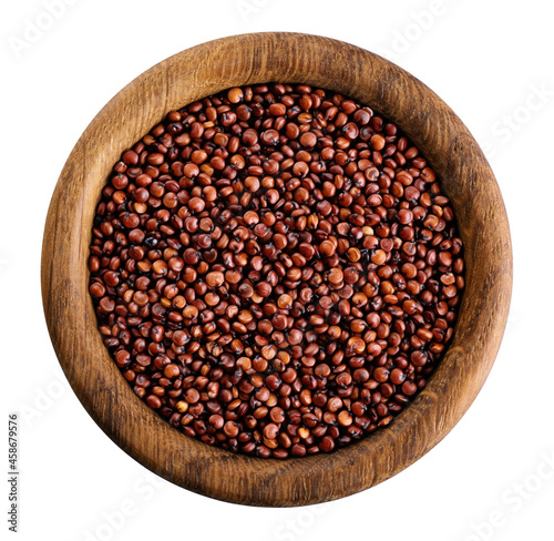 Red quinoa grains in wooden bowl isolated on white background.