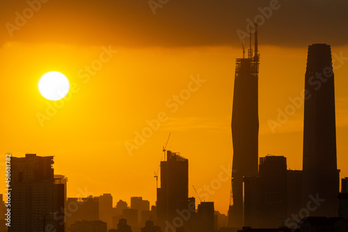Canvas Print KUALA LUMPUR, MALAYSIA - 21st SEP 2021; Majestic and golden sunset over downtown Kuala Lumpur, a capital of Malaysia