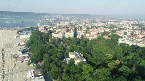 Beautiful cityscape over Varna city, Bulgaria, Beach, old city and sea garden. 4K panoramic aerial view. Varna is the sea capital of Bulgaria. photo