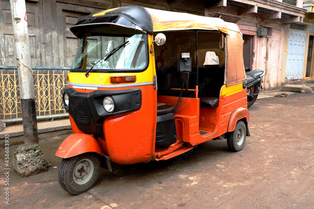 An Indian Auto Rickshaw (Tuk-Tuk) on road.