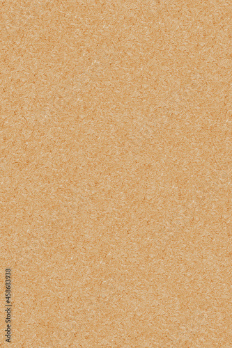 Background and texture of yellow cardboard paper. Vertical photo.