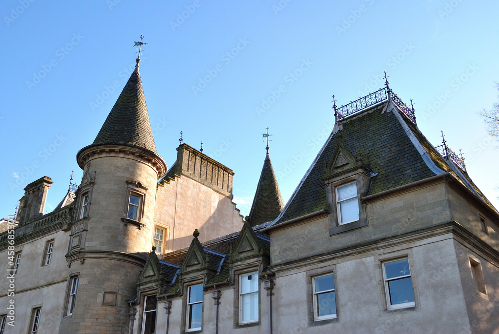 French Style Scottish Baronial Building-Angled View from Below against Blue Sky