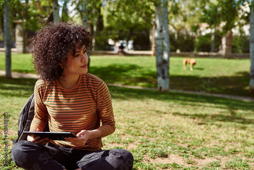 Cute young woman looking away thoughtfully