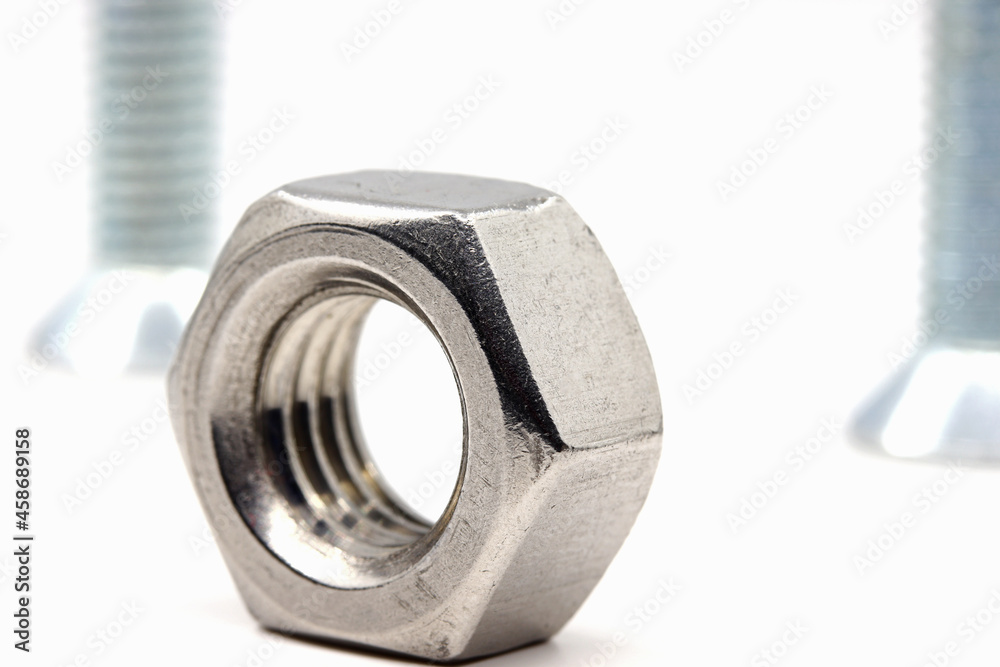 close-up nuts and bolts isolated on white background close-up nuts and bolts isolated on white background