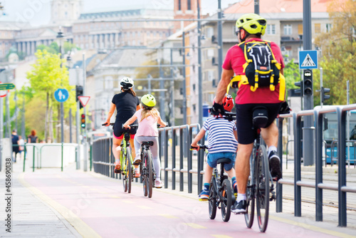 Family riding bikes in the city
