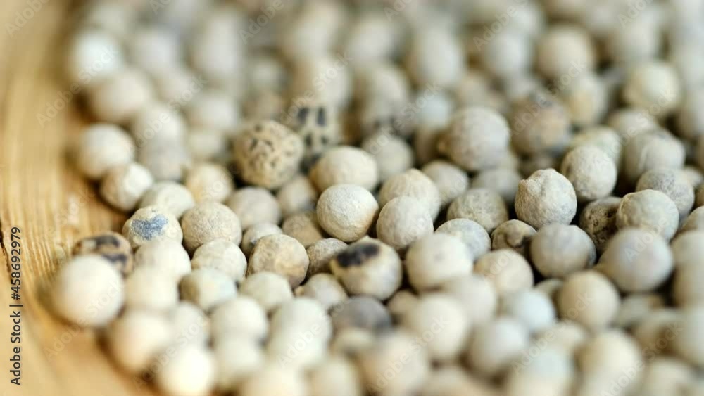 Close-up video of a slowly rotating white pepper