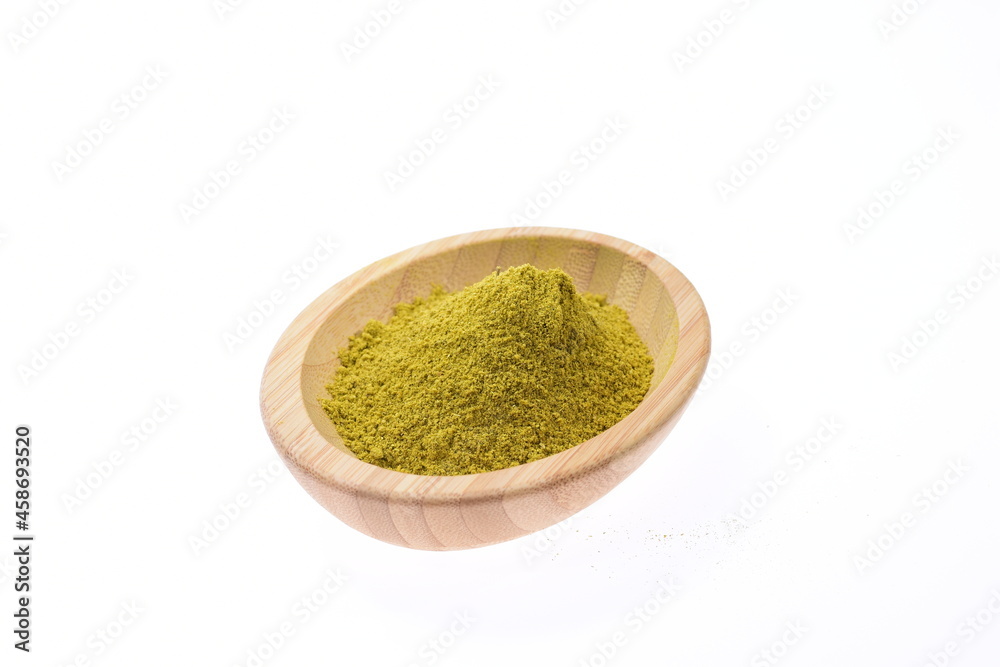 Herbal pepper on a wooden bowl against a white background. Food. Spices. Herbal pepper on a wooden bowl against a white background. Food. Spices.