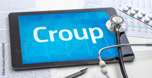 The word Croup on the display of a tablet