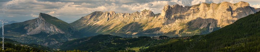 panoramic view from the col de noyer , showing the french alps in evening light ,devoluy , france holiday destination .