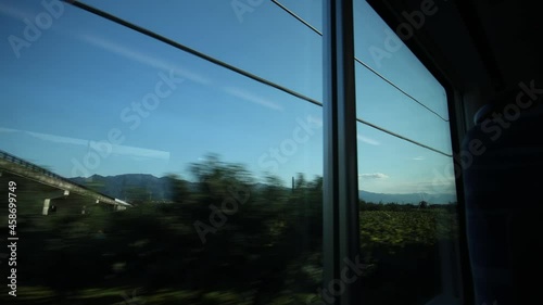 Scenic from train window in Japan, Town in valley.