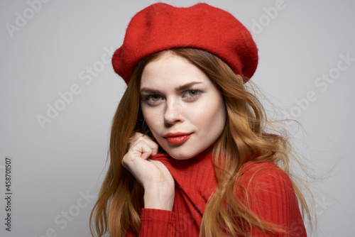 pretty woman with a red cap on his head glamor isolated background