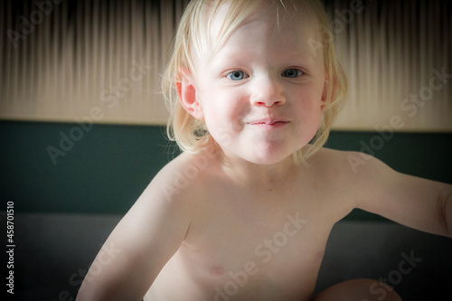 Happy toddler girl dancing indoors
