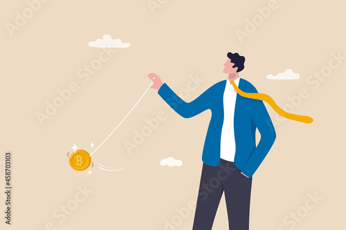 Bitcoin price swing like yoyo, crypto currency risk or volatility, trader control and manipulate price concept, smart businessman investor or trader throw bitcoin yoyo.