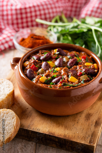 Traditional mexican tex mex chili con carne on wooden table