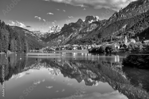 Auronzo Lake and town in summer season, Italian Alps.