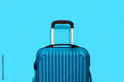 blue suitcasei isolated on blue background