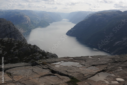 Dramatic panorama of Lysefjord (Lysefjorden) fjord canyon landscape in Norway on a cloudy day in summer  photo