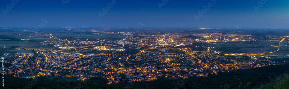 Panoramic aerial view on city after sunset with street lights, Nitra, Slovakia