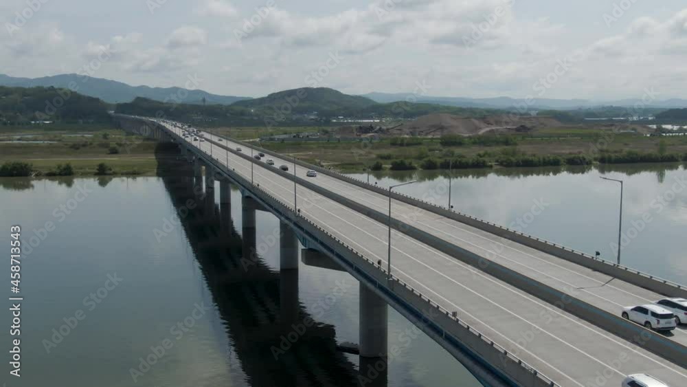 Aerial view of the 2nd Yeongdong expressway across the river, car driving on highways, May, 2021. 제2 영동고속도로, 광주 원주 고속도로. Aerial view of the 2nd Yeongdong expressway across the river, car driving on highways, May, 2021. 제2 영동고속도로, 광주 원주 고속도로.