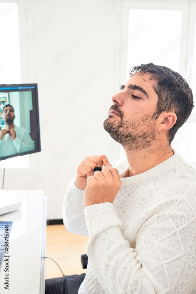 Fototapeta premium serious man with white sweater in office