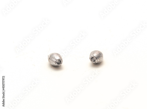 Two silver egg sinkers fishing tackle for Carolina rigging casting isolated on white
