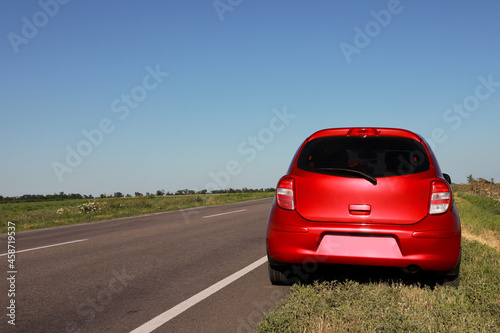 Modern car near asphalt road outdoors on sunny day © New Africa