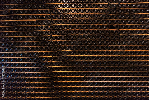 Bottles of wine and cava resting in the cellar
