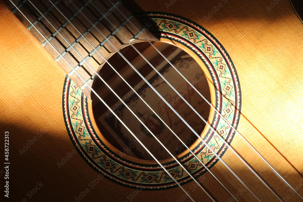 Naklejka premium Detail of classical Spanish acoustic guitar sound hole and part of the fretboard