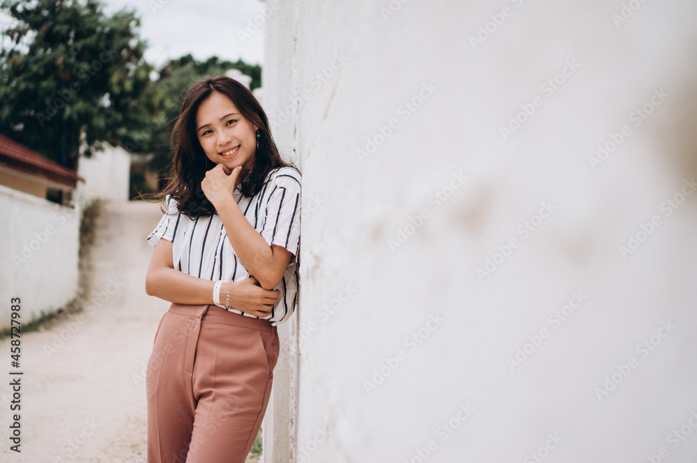 Asian woman on a vacation by the beach Asian woman on a vacation by the beach