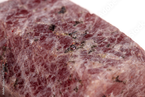 Macro mineral stone Ruby in the breed a white background