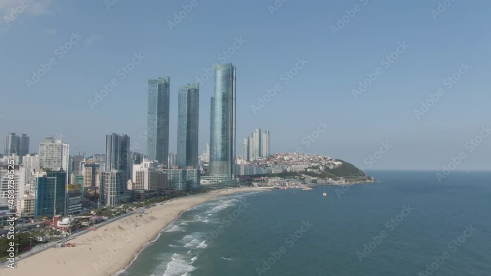 Aerial view of Haeundae beach in the Busan. Skyscraper and Haeundae beach. May, 2021. 부산, 초고층빌딩, 해운대 해수욕장. Aerial view of Haeundae beach in the Busan. Skyscraper and Haeundae beach. May, 2021. 부산, 초고층빌딩, 해운대 해수욕장.