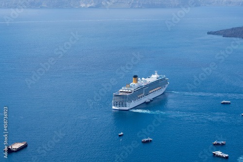 Santorini/Greece: 09/07/2019: Big cruise ship in the middle of the sea in Santorini, Greece