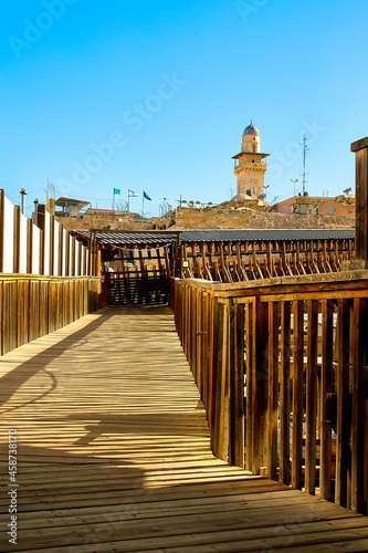 on Wooden ramp leading to the Moroccan Gate which (also known as Mugrabi Gate), Temple Mount and Dome of the Rock. Bab al Silsila Minaret. old city of jerusalem, israel photo