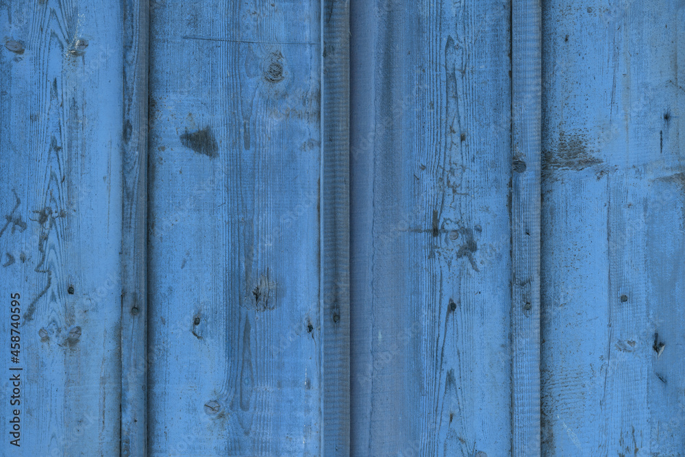 Natural pattern and texture of rough and old wood planks surface dyed with blue color. Natural pattern and texture of rough and old wood planks surface dyed with blue color.