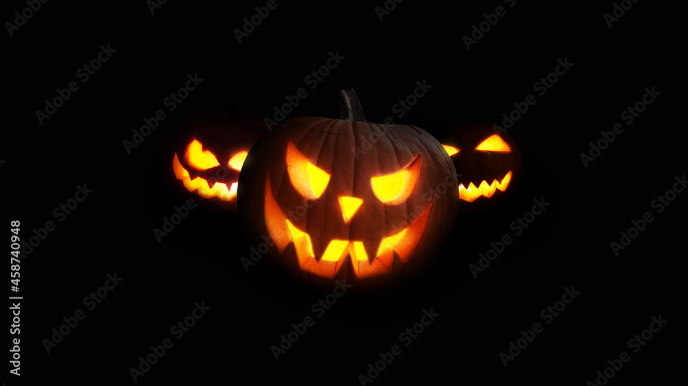 Scary Pumpkins glow at night. Halloween picture on a black background. Fear and the holidays concept Scary Pumpkins glow at night. Halloween picture on a black background. Fear and the holidays concept